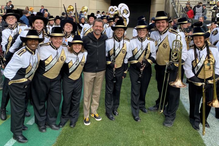 President Todd Saliman with CU Boulder's Golden Buffalo Marching Band